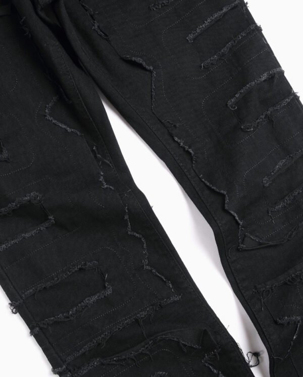 Jean en Denim Stretch Déchiré pour Homme – Coupe Ajustée et Micro-Évasée avec Ourlet Effiloché Style High Street